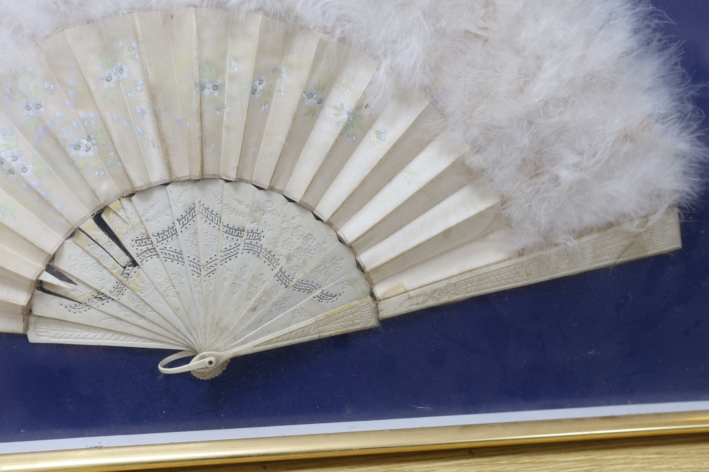 A cased bone, silk and swans down fan, 62cm wide